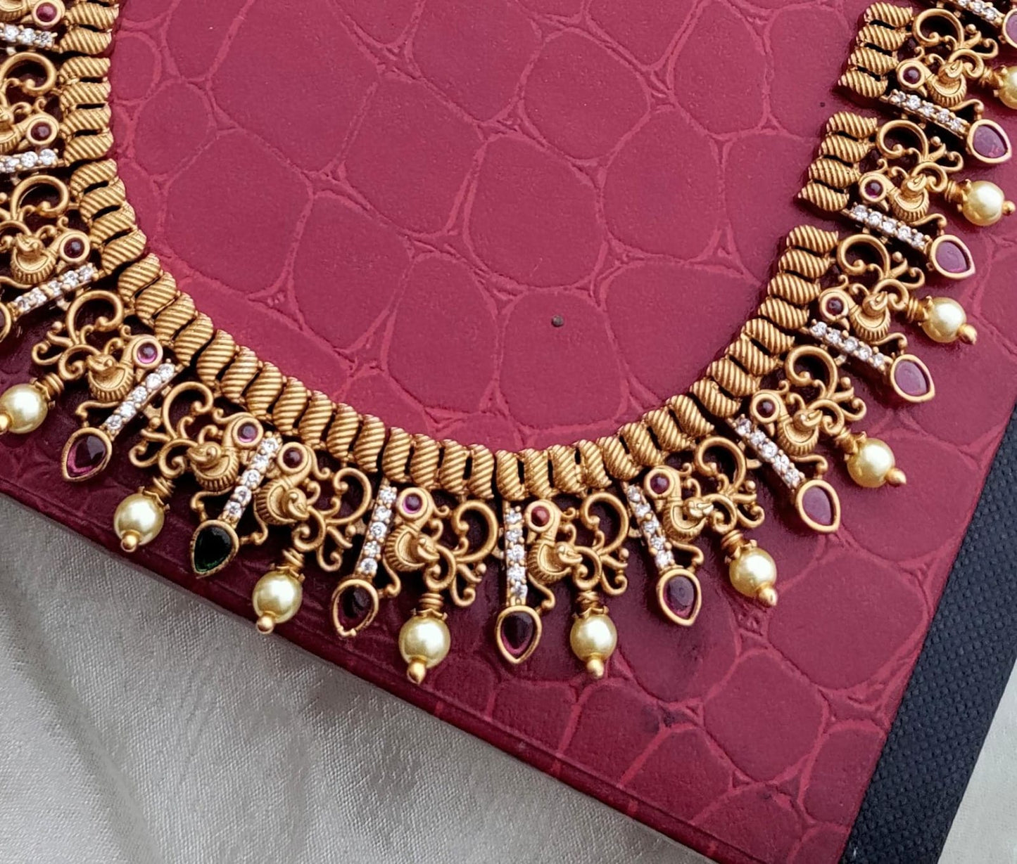 Peacock ruby kemp stone long set