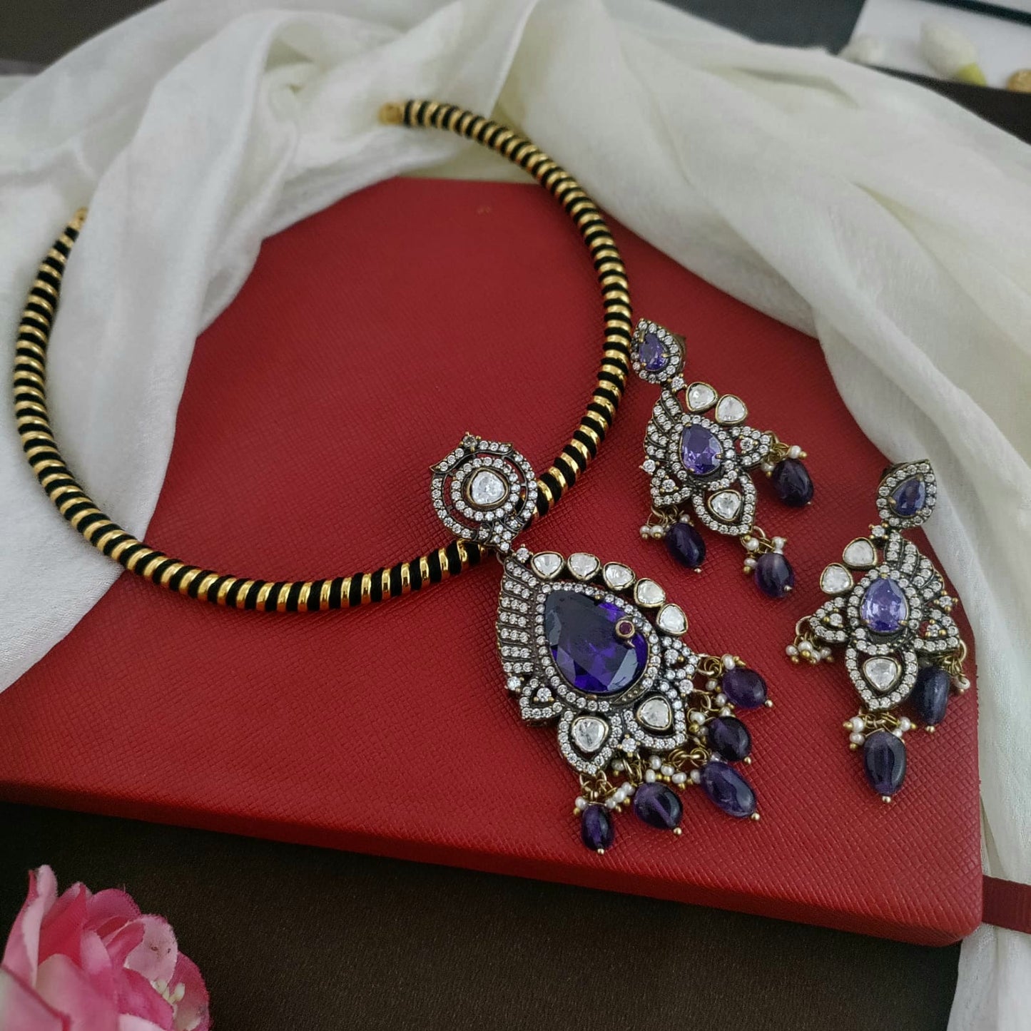 Victorian finish purple with white stone hasli set