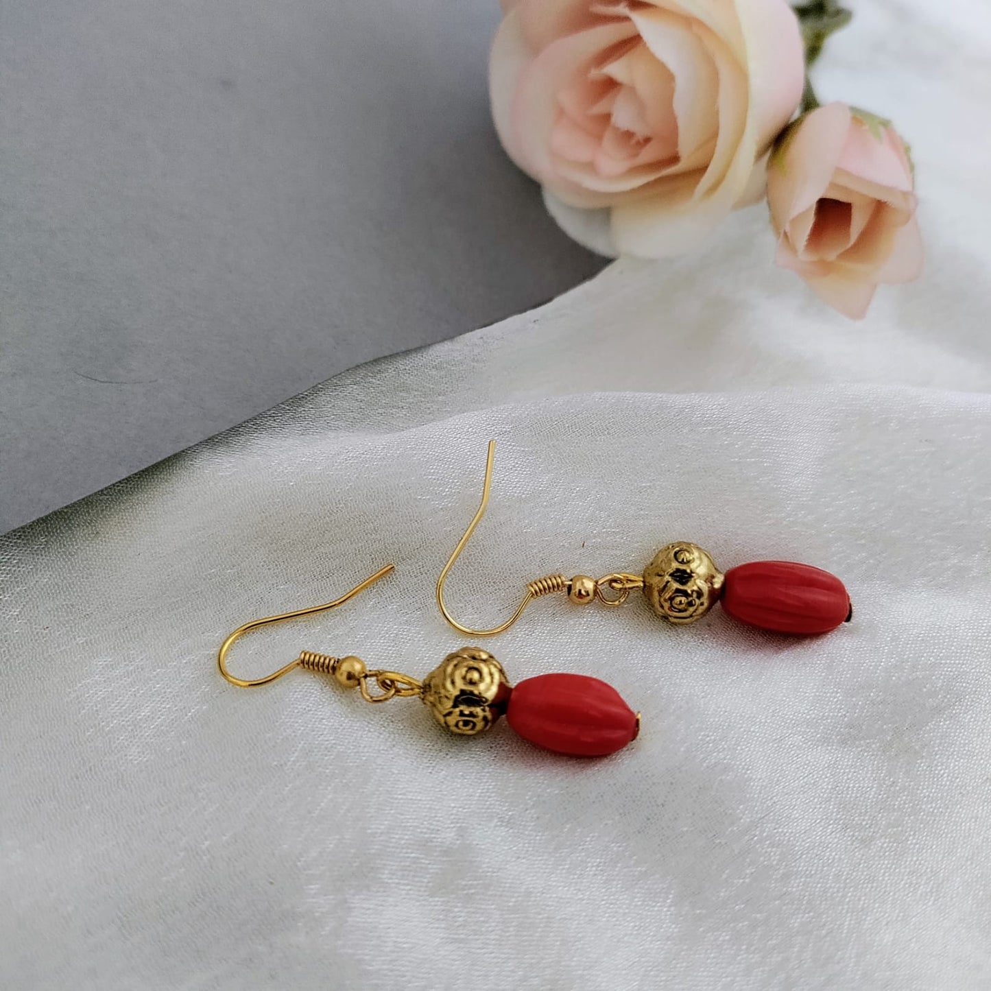 Coral red beaded earring