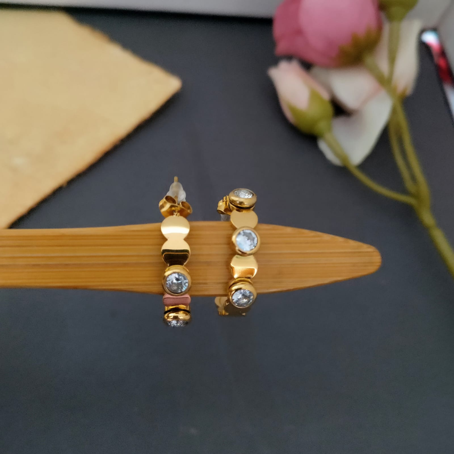 White stone studed hoop earring