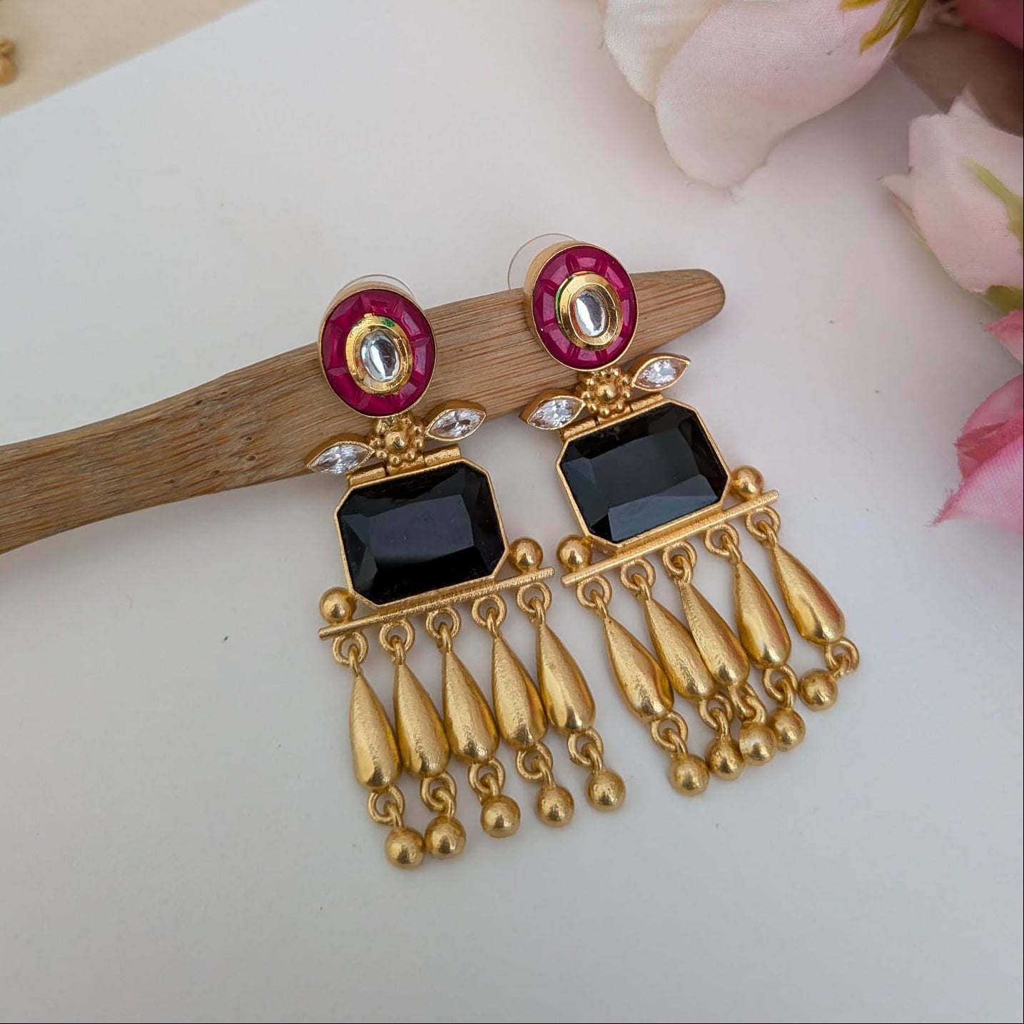 Golden stone studded dangler earring