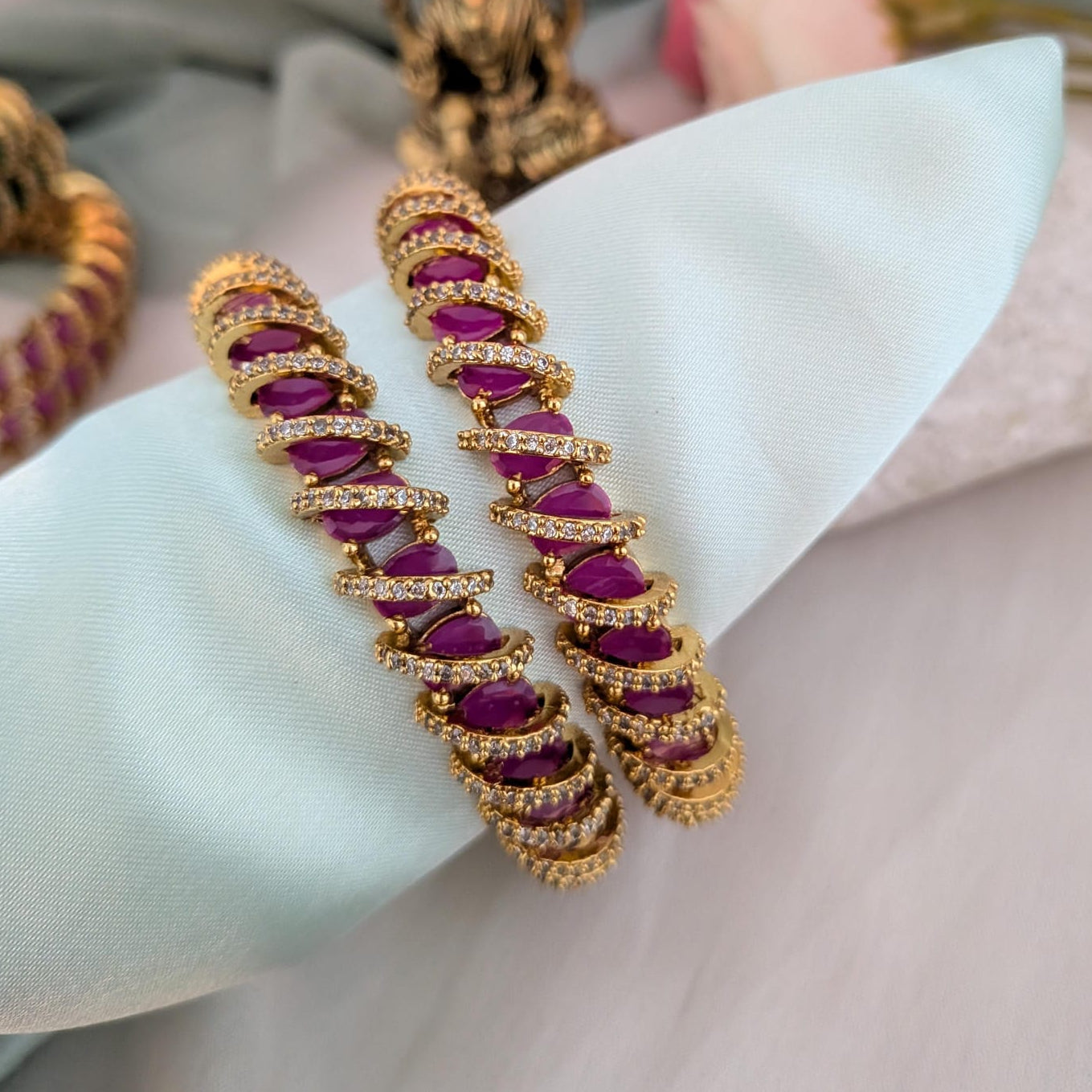 AD stone studded Spiral Bangle