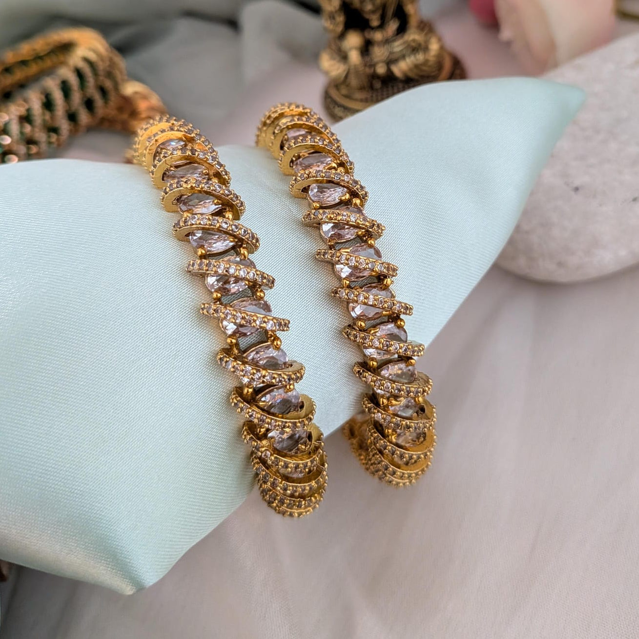 AD stone studded Spiral Bangle
