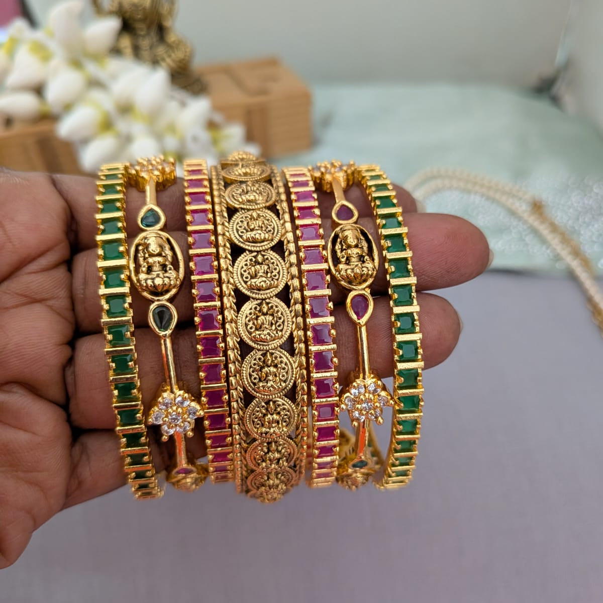 Lakshmi design in green and ruby stone bridal bangle