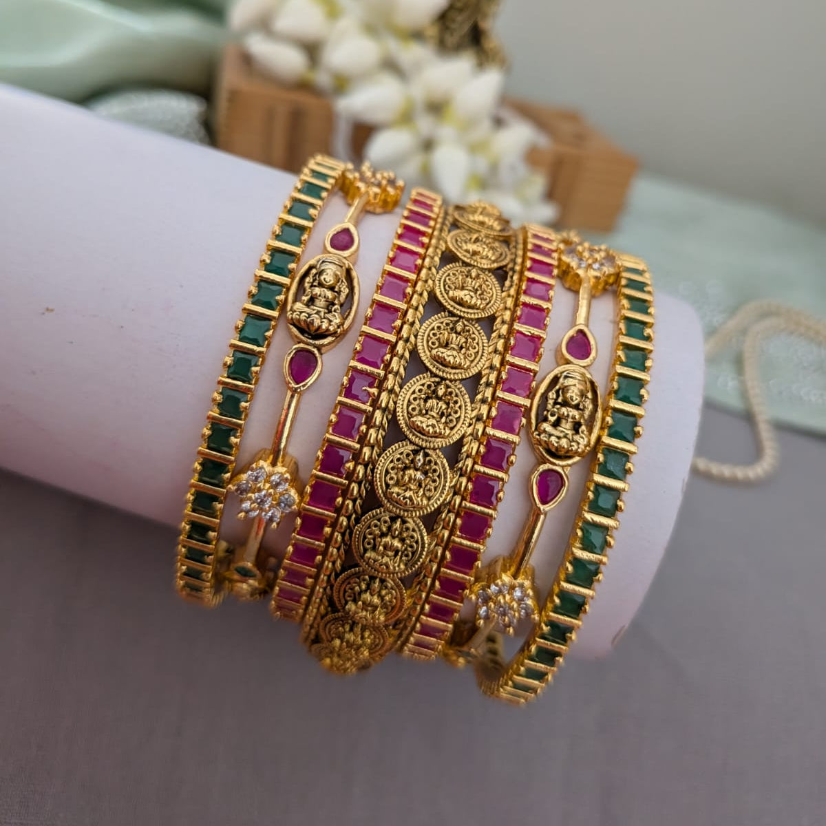 Lakshmi design in green and ruby stone bridal bangle