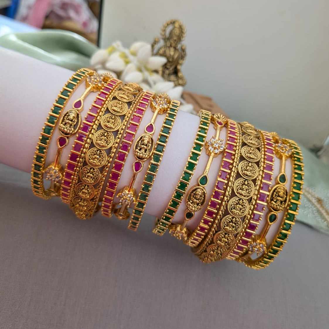 Lakshmi design in green and ruby stone bridal bangle