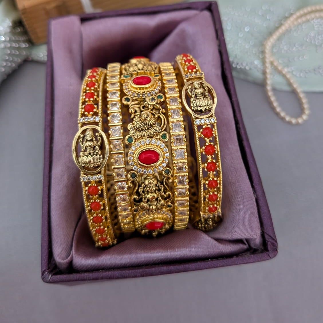 Nakshi work coral stone studded bridal bangle