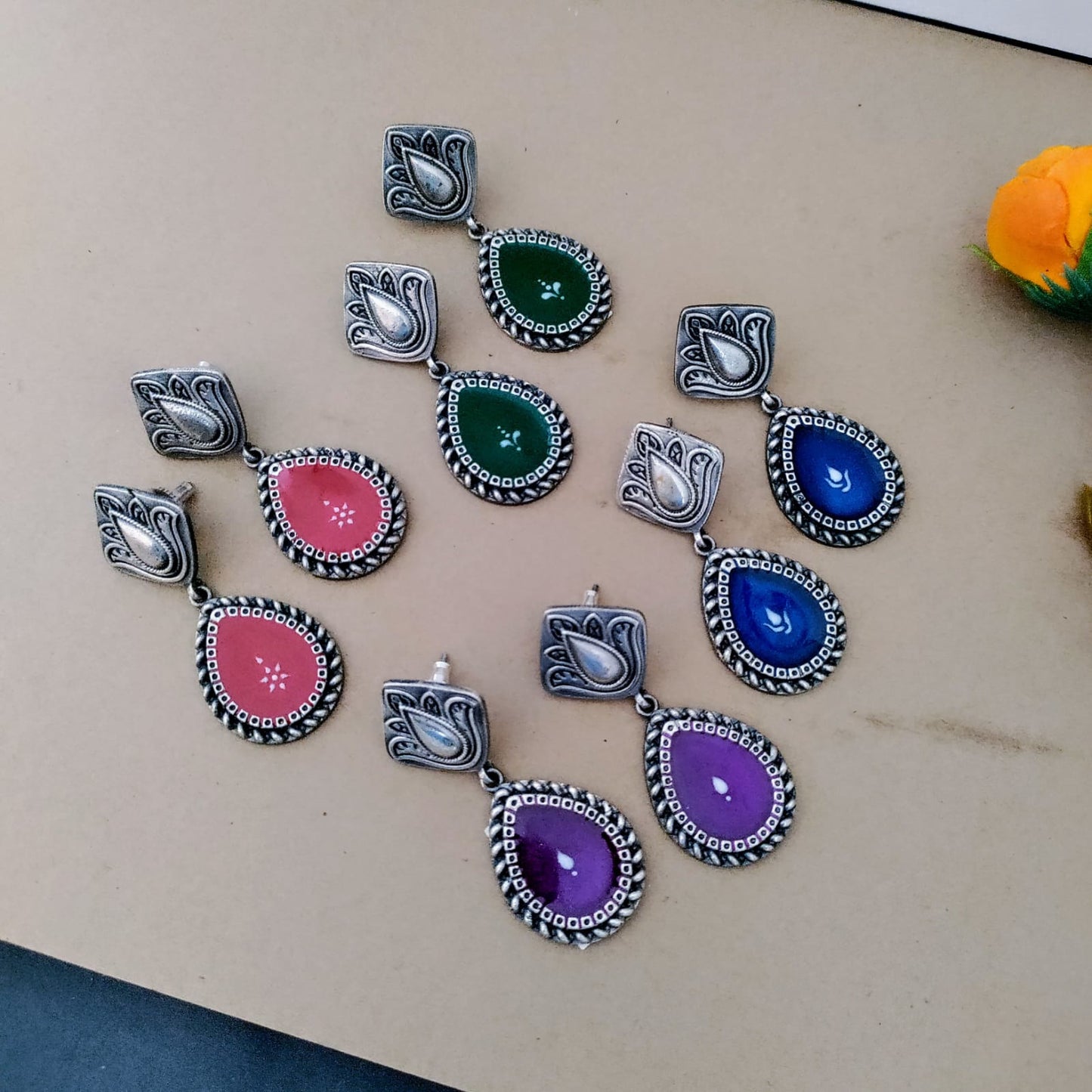 Flower painted peacock jumka