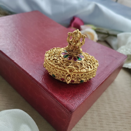 Oval shaped sindoor box with lakshmi
