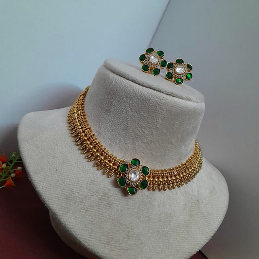 Golden necklace with jadau center pendant