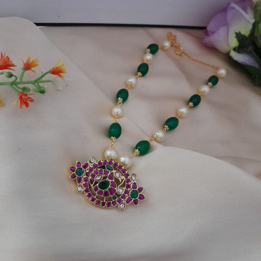 Jadau kundan pendant with green and pearl beaded chain