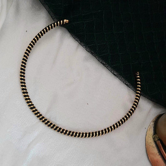 Black with golden hasli