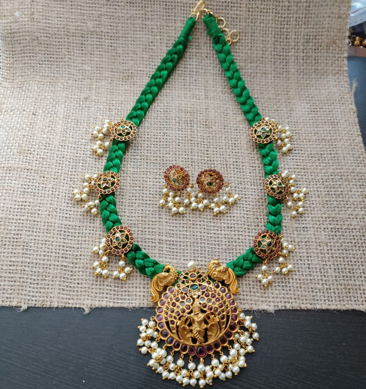 Green threaded necklace set with kemp krishna pendant