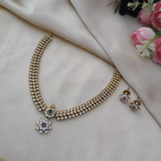 Gorgeous necklace set made with small white stone studded around golden floral