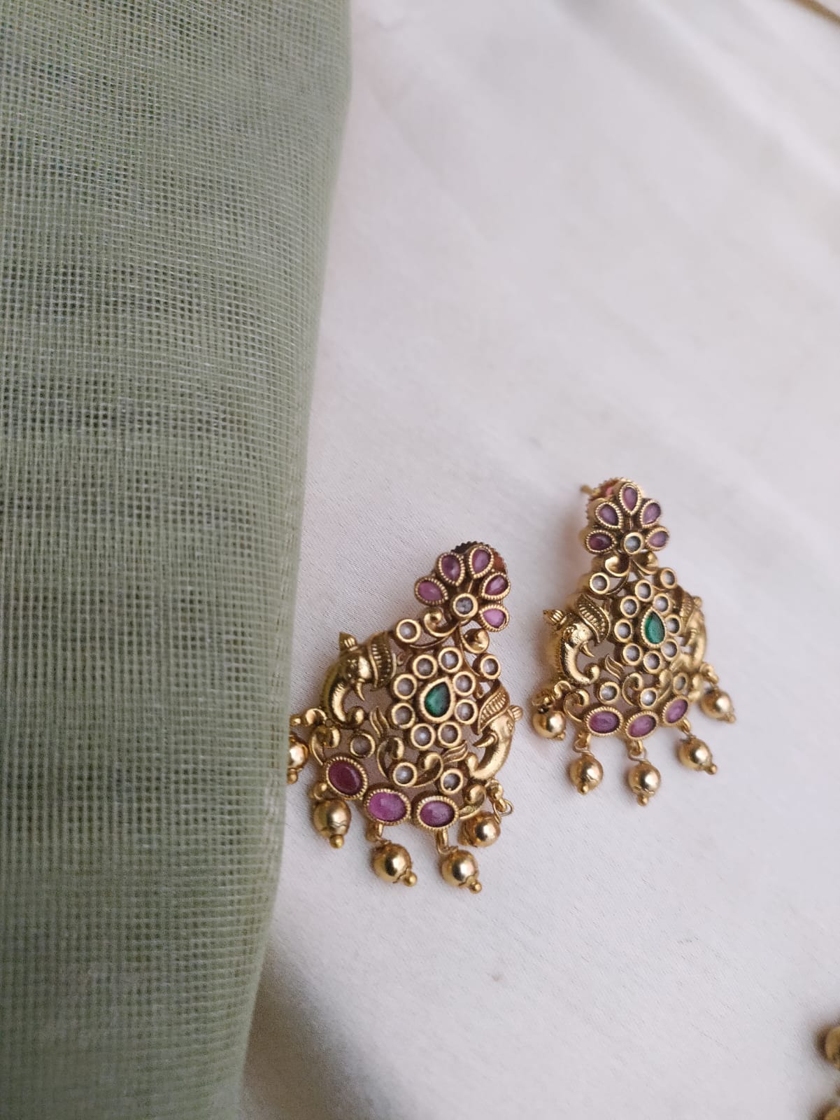 Ruby kemp studded elephant truck motif necklace