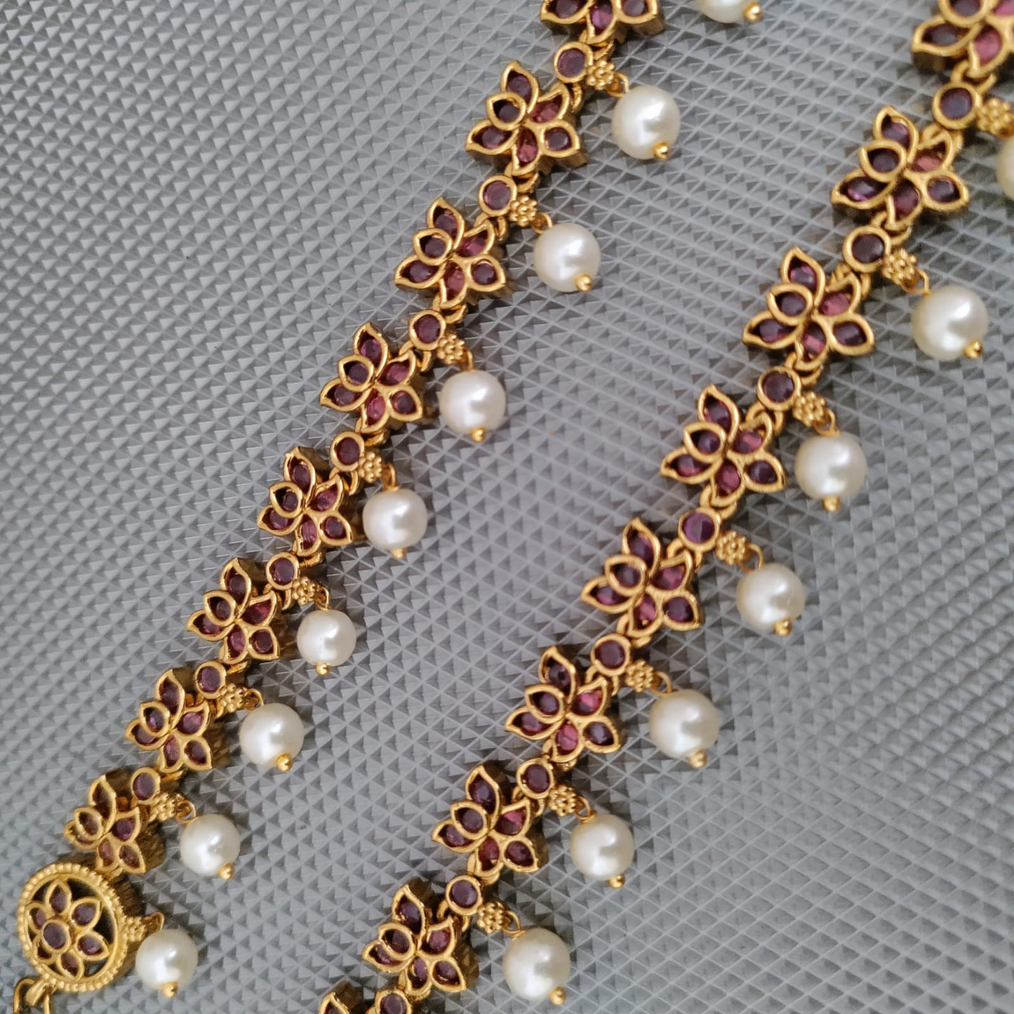 Ruby lotus pearl drop kemp earchain