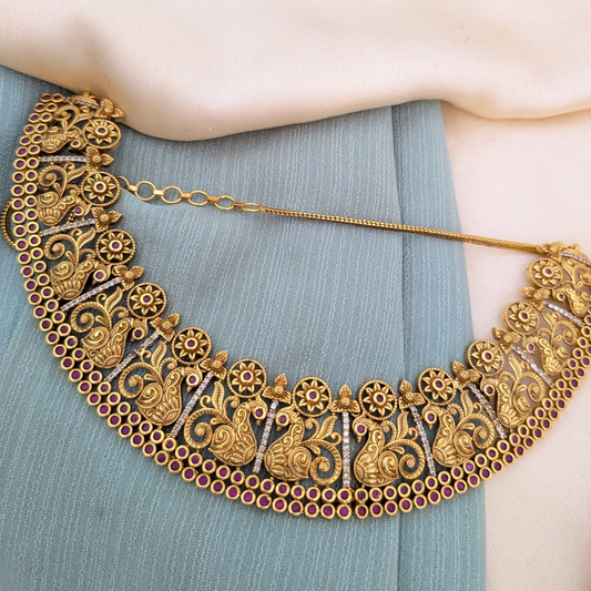 Broad necklace with peacock design