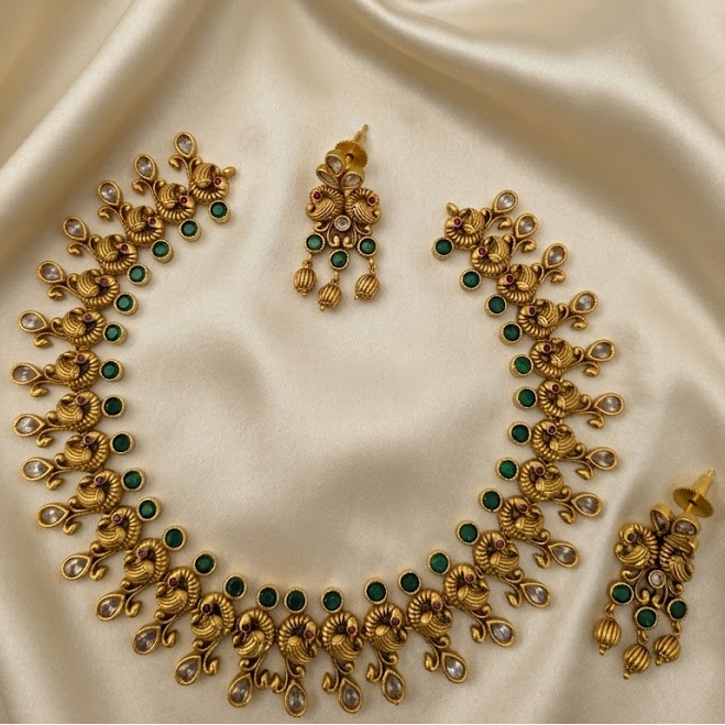 Timeless beauty of peacock paired with emerald stone necklace