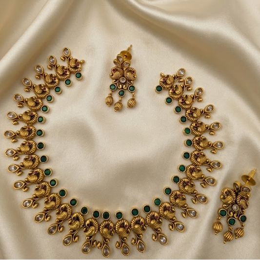 Timeless beauty of peacock paired with emerald stone necklace