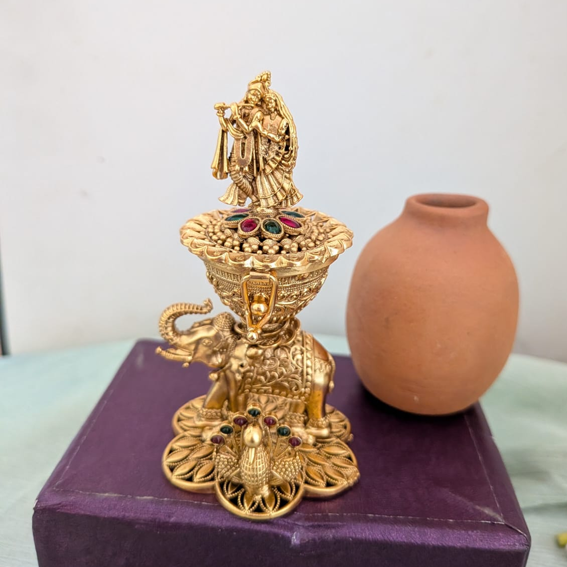 Intricate design with Radha krishna on the Sindoor box