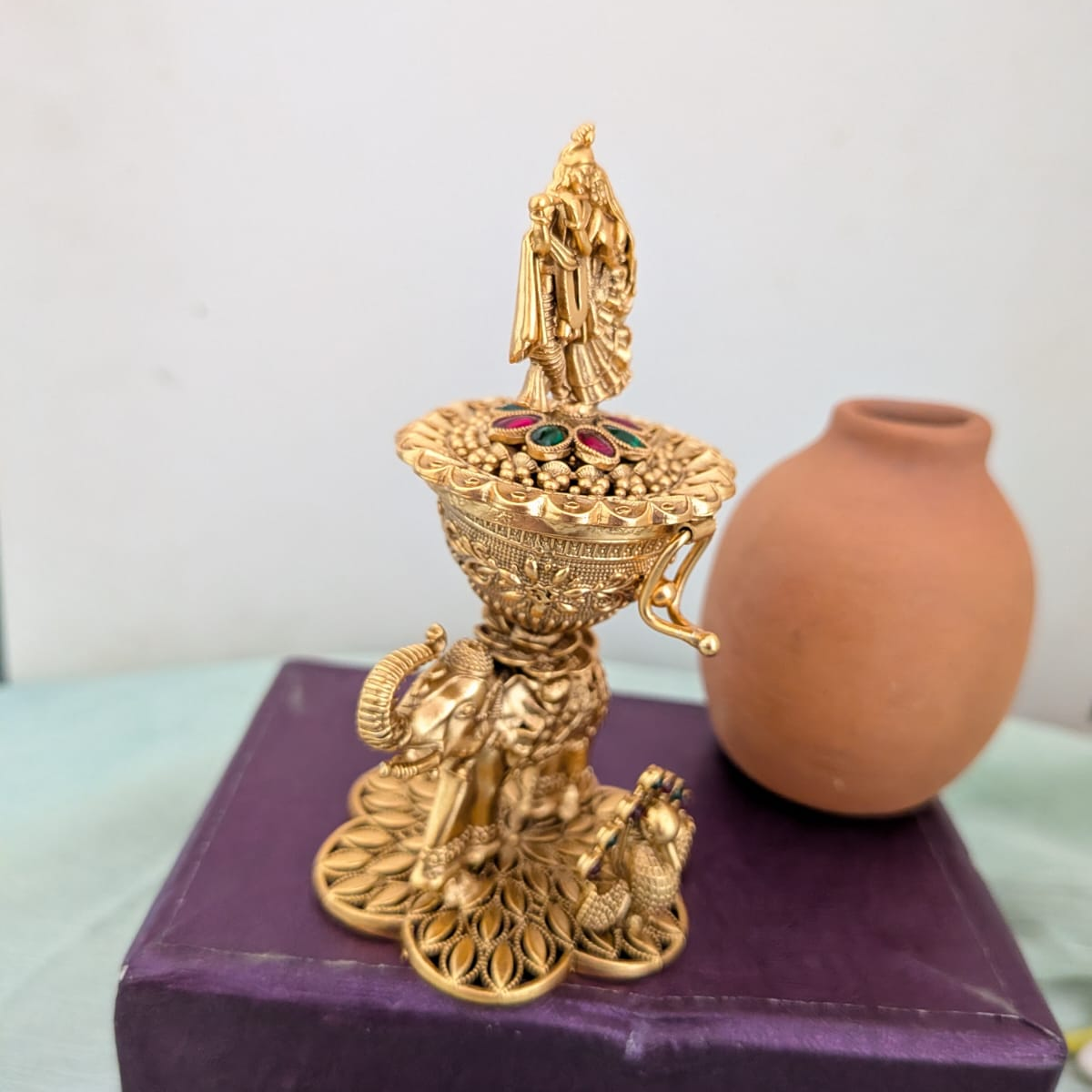 Intricate design with Radha krishna on the Sindoor box