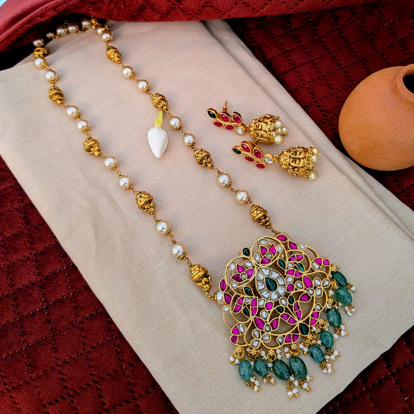 Jadau kundan floral pendant long haram with nakshi work ball