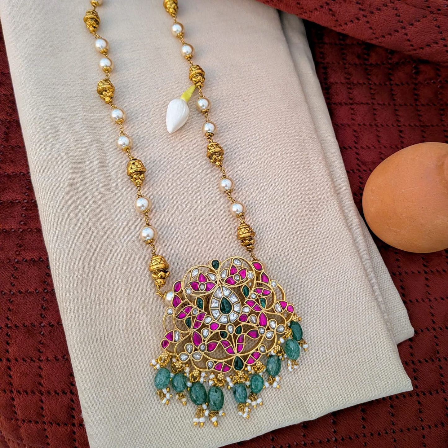 Jadau kundan floral pendant long haram with nakshi work ball